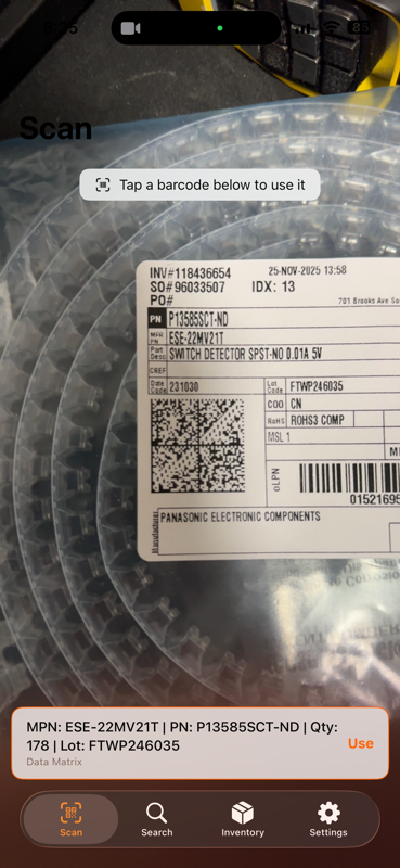 warecache iPhone app scanning a Data Matrix code on a component reel label and showing the decoded manufacturer part number, quantity, and lot